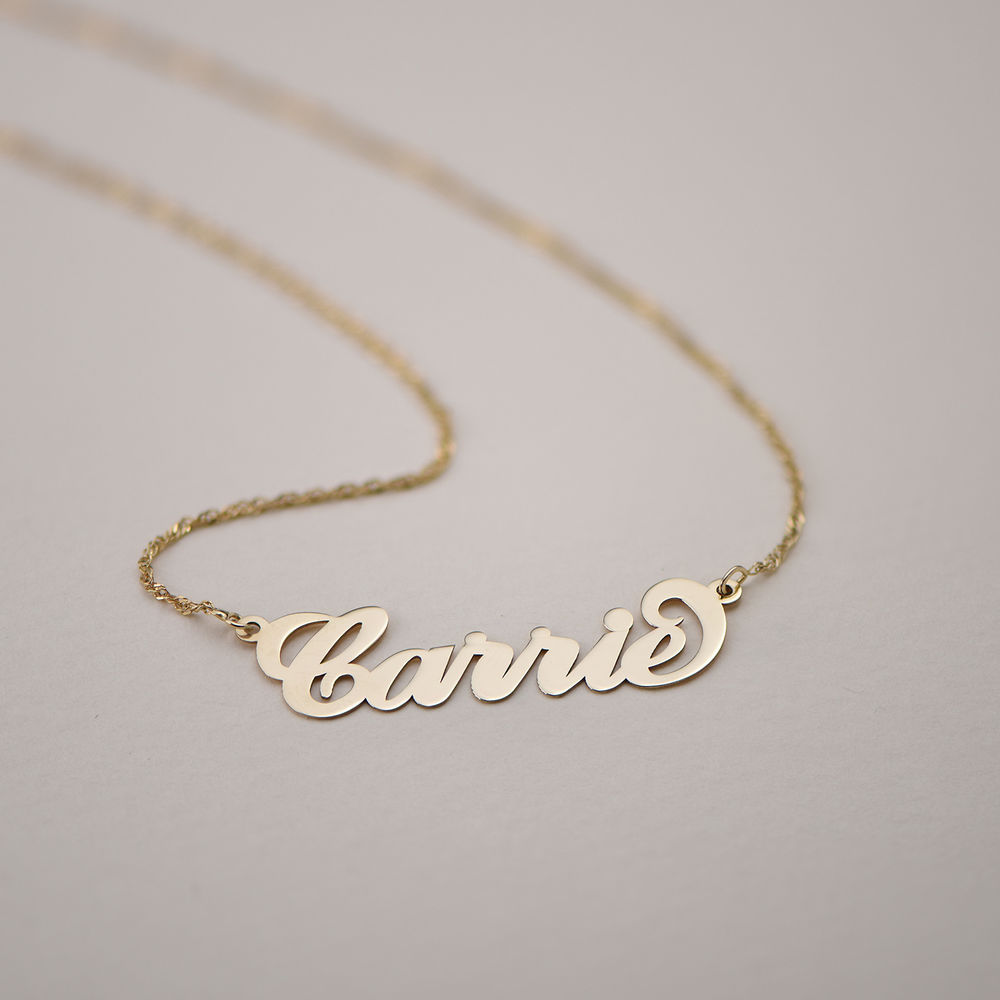 Personalized 14k Gold Carrie Name Necklace displayed against a neutral background