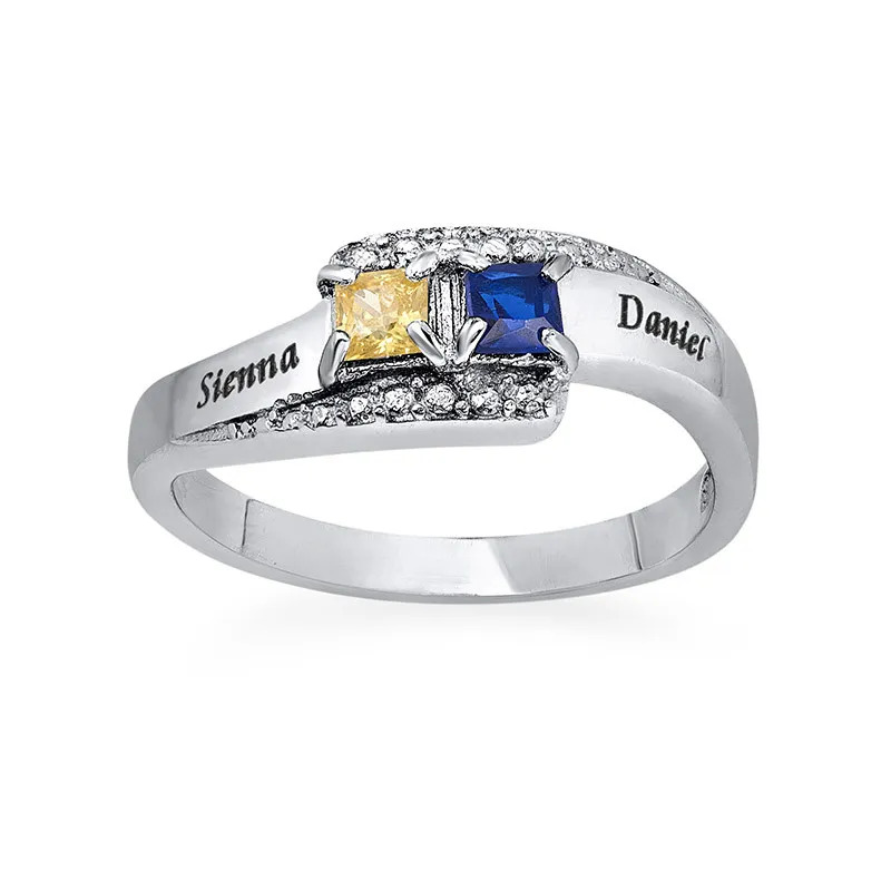 Stock image of an engraved  ring with two birthstones