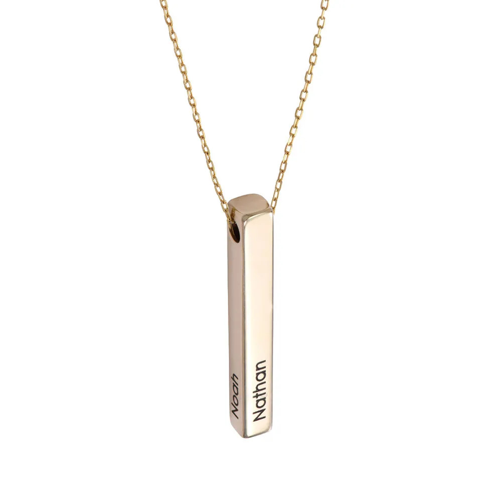 Stock image of a gold plated necklace with an inscribed vertical pendant 
