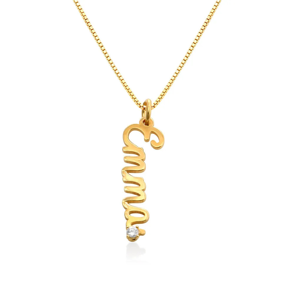 Stock image of a gold plated name necklace with a vertical name pendant 