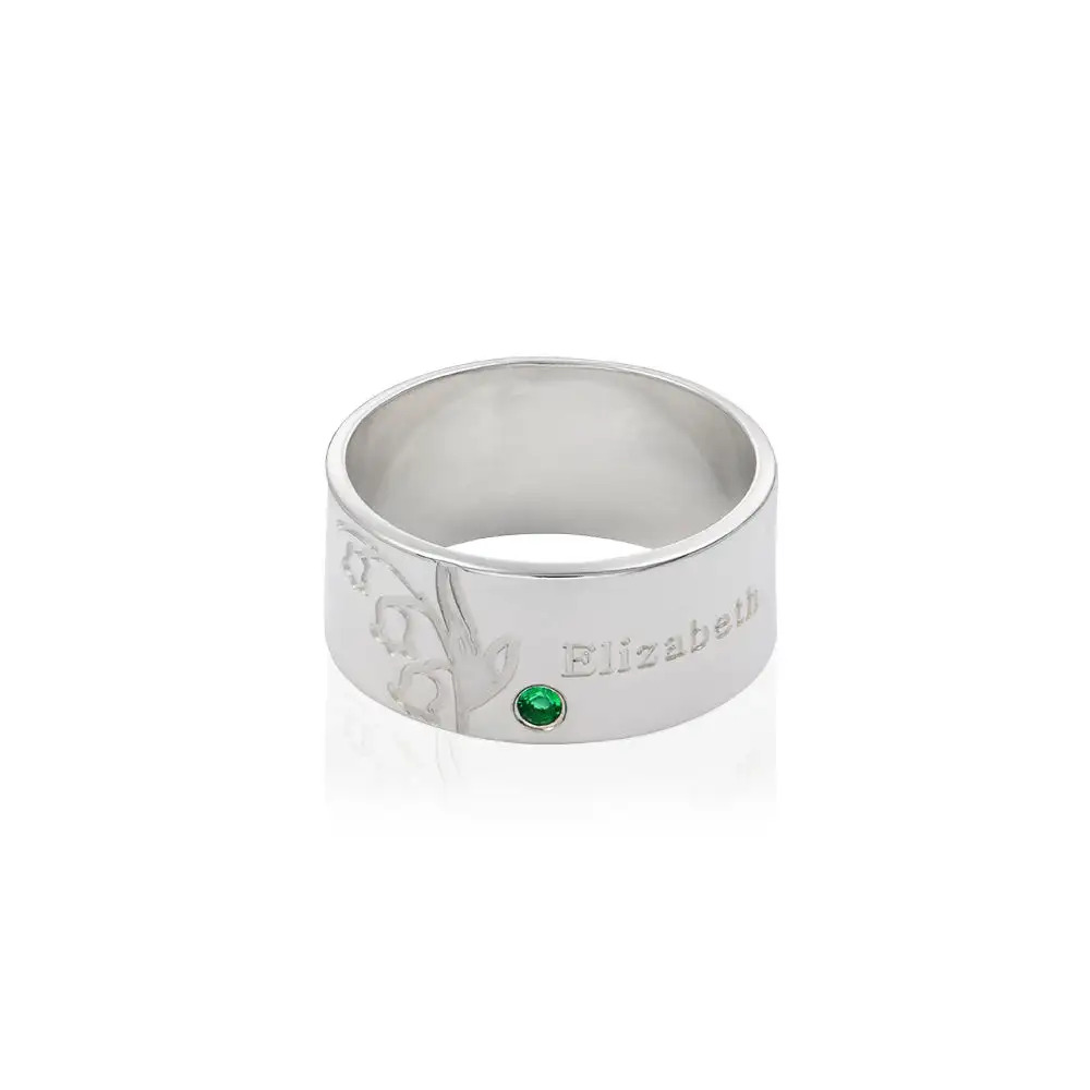 Stock image of a silver birthstone inscribed ring