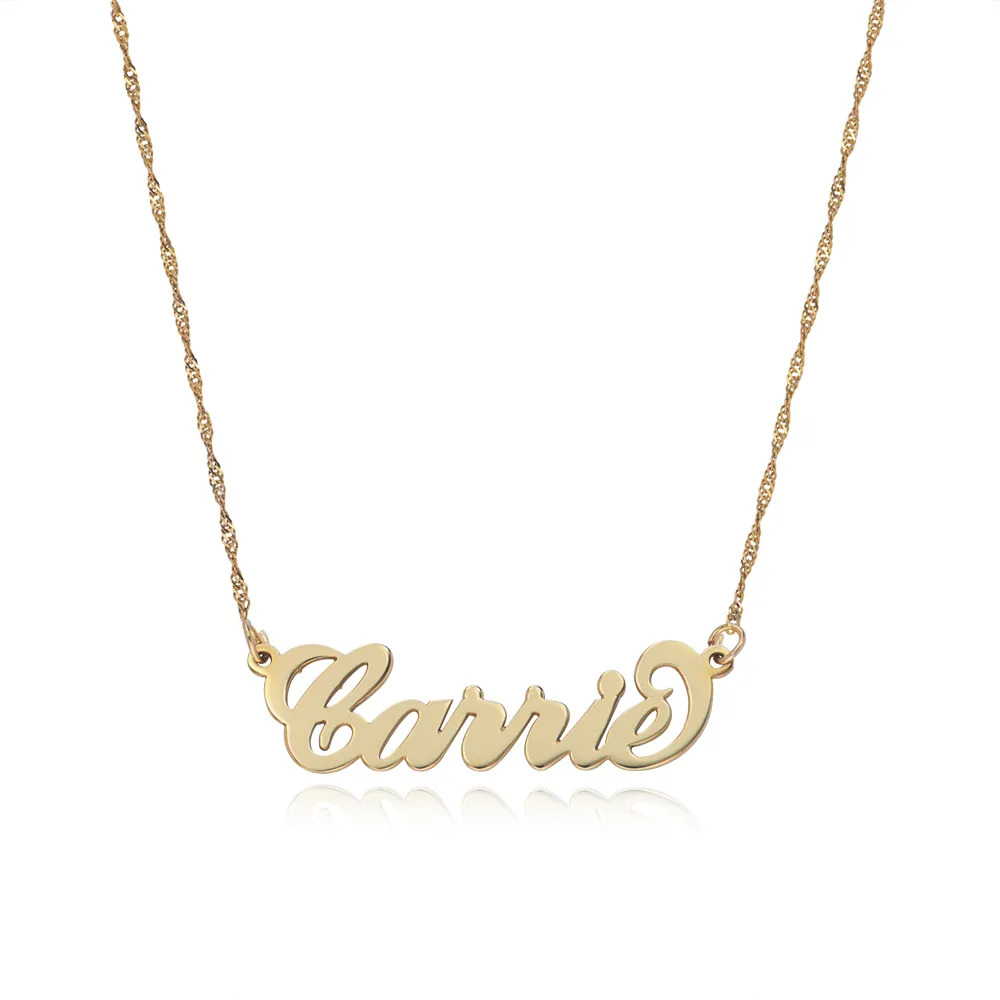 Stock image of a gold name necklace that reads "Carrie"