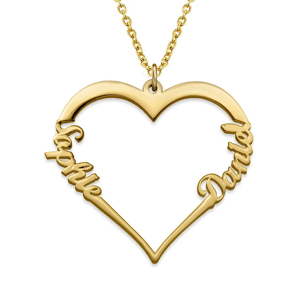 Stock image of a gold necklace in heart shape with two names