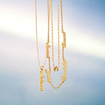 3 Gold necklaces hanging on a blue background