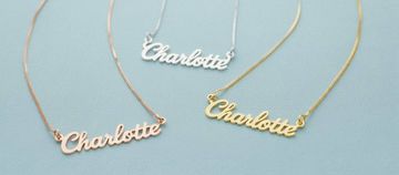 three personalized necklaces with the name Charlotte on a blue background