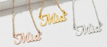 3 styles of Mia name necklaces on a white surface