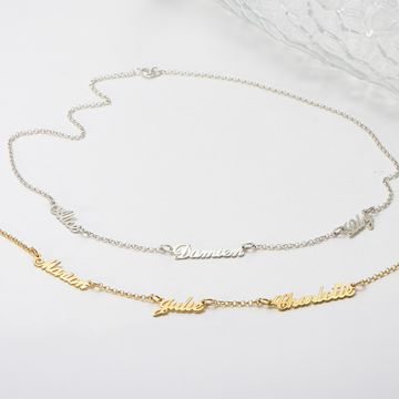 a couple of necklaces that are sitting on a table in White Gold and Yellow Gold
