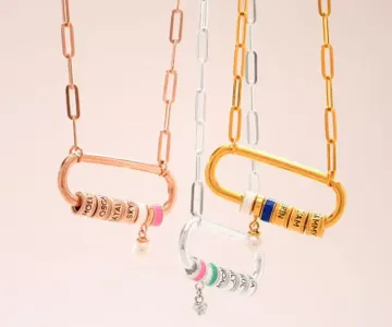 a couple of carabiner necklaces hanging