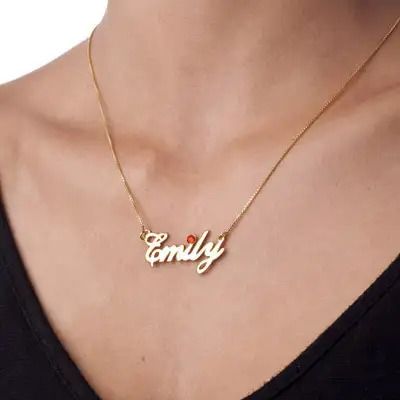 A gold-plated necklace that reads "Emily" around a woman's neck
