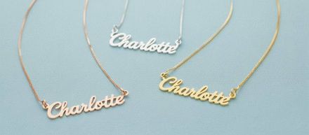 three personalized necklaces with the name Charlotte on a blue background