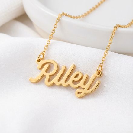 a gold plated necklace with the word riley on it