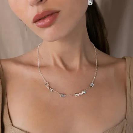 a woman wearing a necklace with names