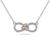 Stock image of a silver necklace with an interlocking diamond infinity pendant and rose gold heart