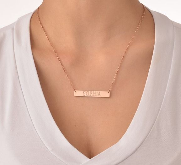  Woman wearing a rose gold Bar Name Necklace from MYKA