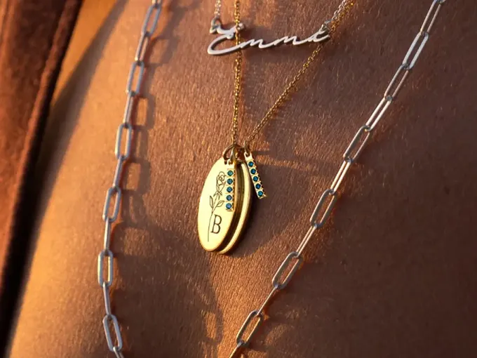 a close up of a person wearing a necklace