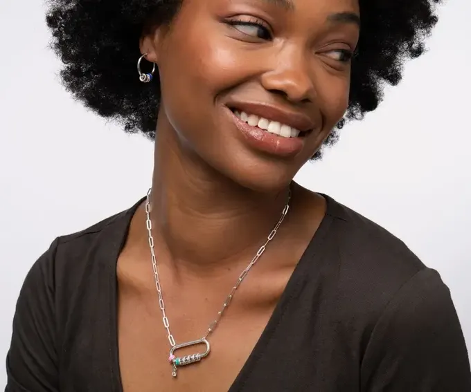 woman wearing silver carabiner necklace with link chain