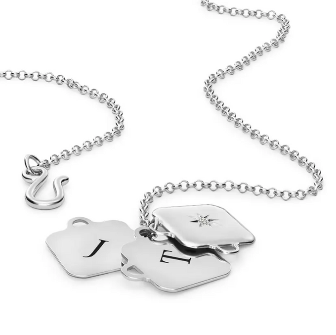 Made to Treasure Initials Locket Necklace in Silver a couple of necklaces that are on a chain