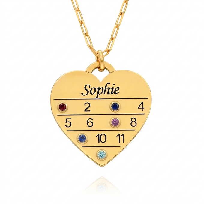 a necklace with a heart shaped pendant with the five names and birthstones on it