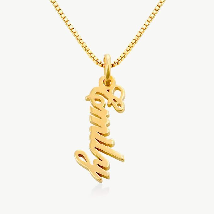 a gold necklace with the word love on it