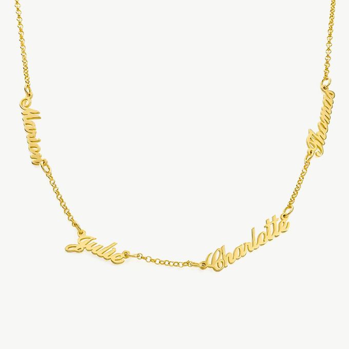 a gold necklace with the word'love'written on it