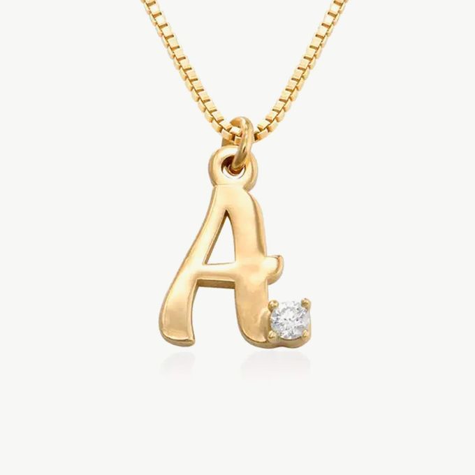 Diamond Initial Necklace a initial necklace with a diamond in the middle