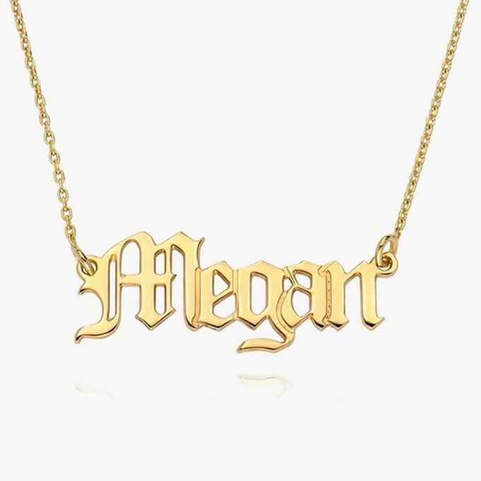 a gold plated name necklace with the word morgan on it