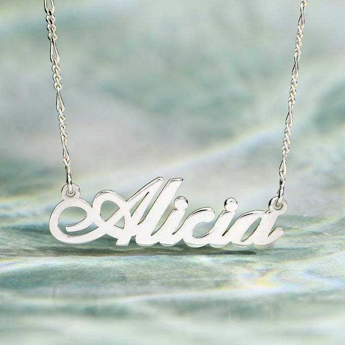 a silver necklace with the word alicia on it