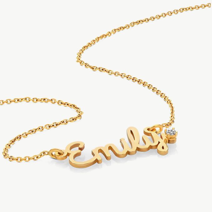 a gold necklace with the name emily