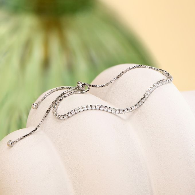 Holly Adjustable Tennis Bracelet a close up of a silver sparkly bracelet