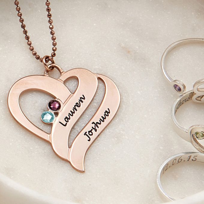 a couple of necklaces sitting on top of a table