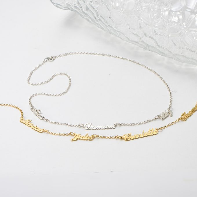 a couple of necklaces sitting on top of a table