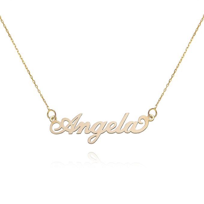 a gold plated necklace with the word angels on it