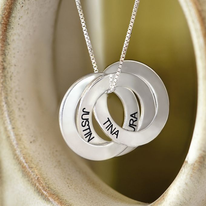 a couple of necklaces sitting on top of a table