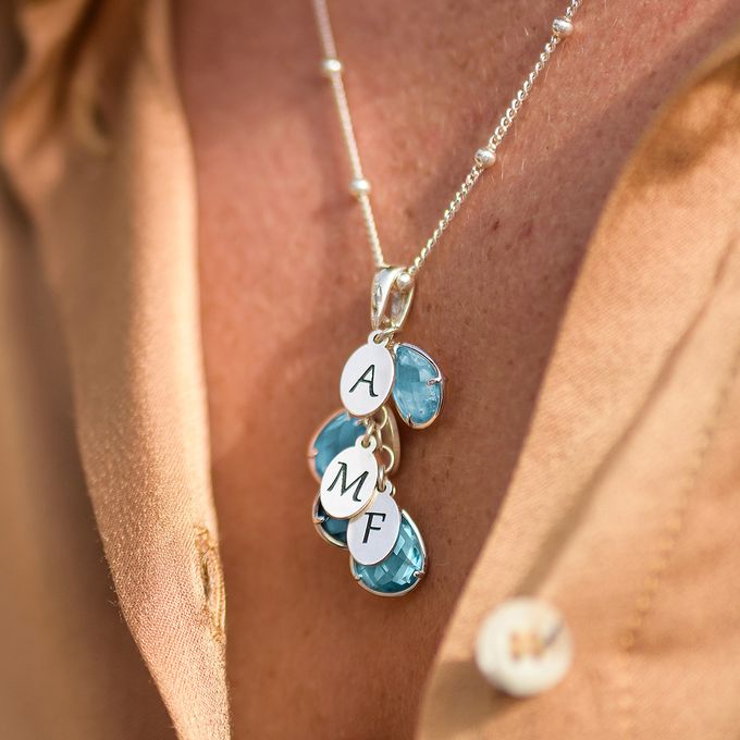 a close up of a person wearing a necklace