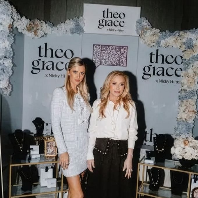 two beautiful women standing next to each other