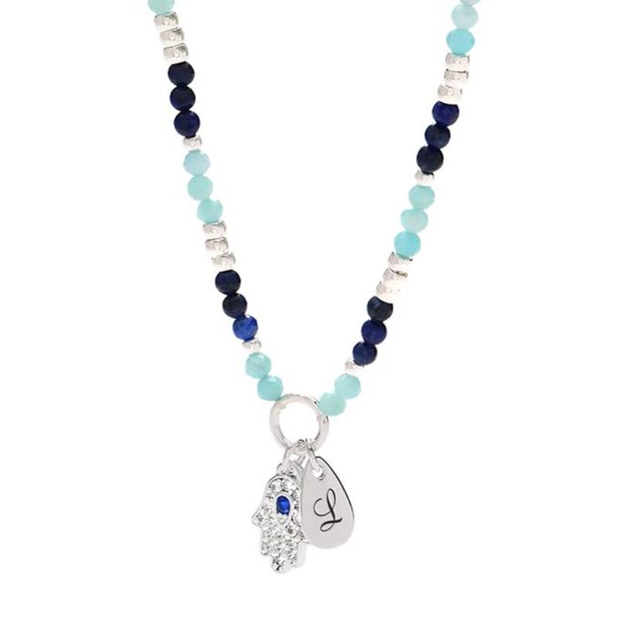 a blue beaded L initial necklace with a silver charm
