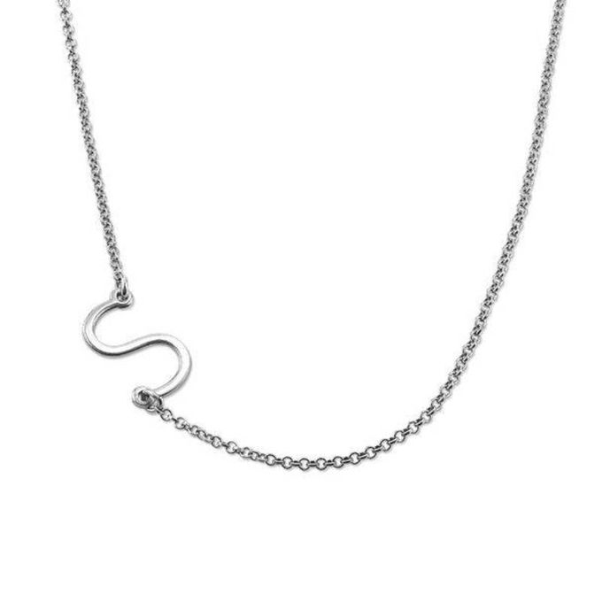 a silver necklace with a letter s on it