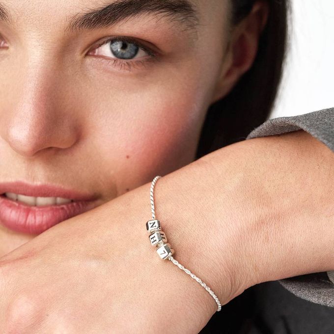 a close up of a person wearing a bracelet