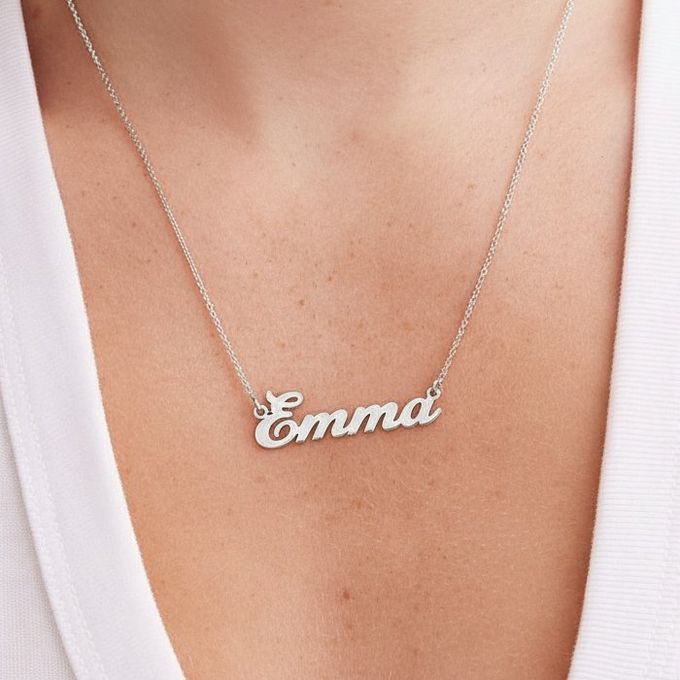 Classic Cocktail Name Necklace in Sterling Silver a woman wearing a necklace with the word Emna on it