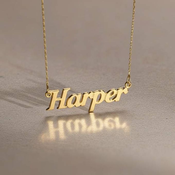 Harper Angel Style Name Necklace in Gold a gold necklace with the word harper on it