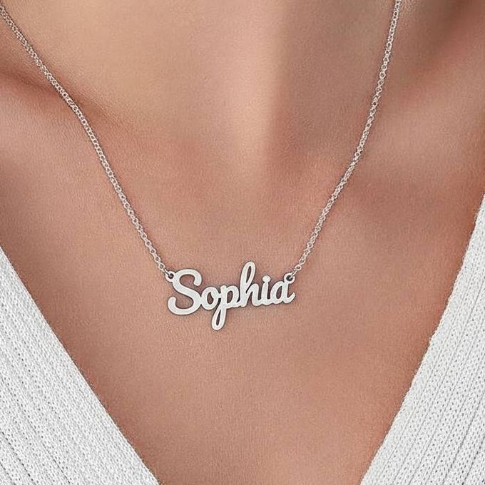 a woman wearing a necklace with the word sophia on it