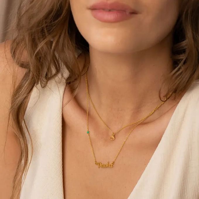 Bridget Evil Eye Layered Name / Initial Necklace with Gemstone in Gold Plating a close up of a woman wearing a evil eye name necklace