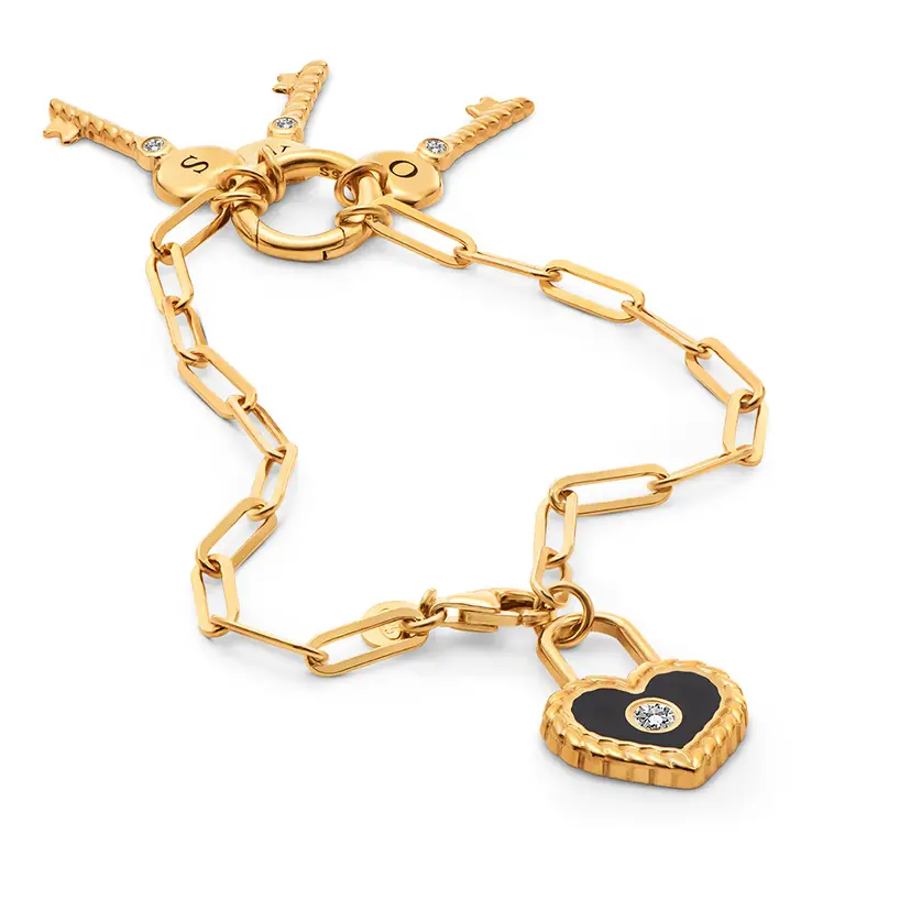 initial key and lock bracelet with black lock charm a gold chain with a heart and a lock