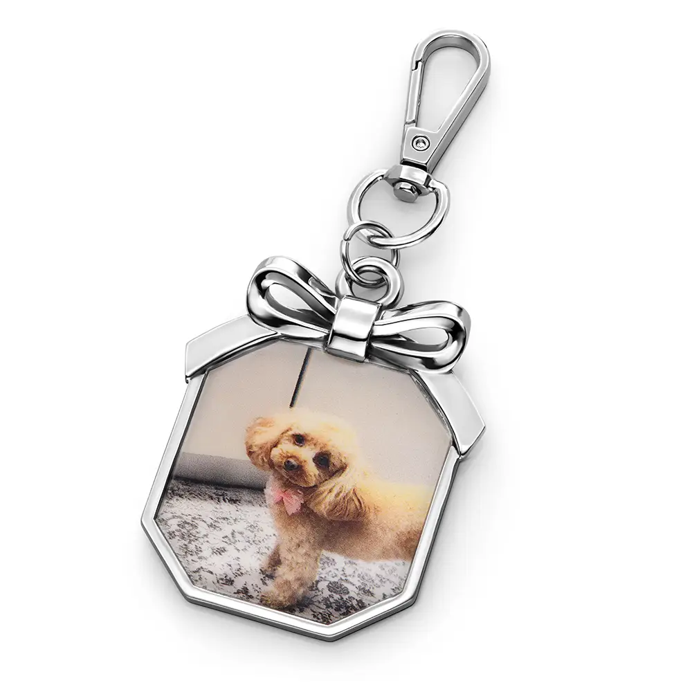 bag charm with a picture of a dog on it