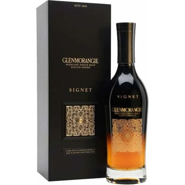 a bottle of whisky next to a box