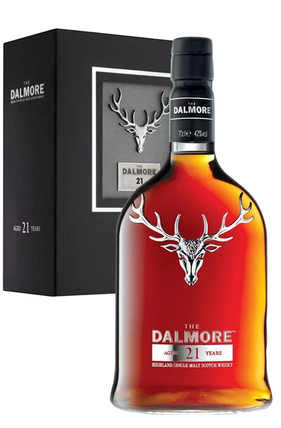 a bottle of Dalmore 21 single malt whisky next to a gift box by the same brand