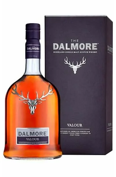 a bottle of Dalmore Valour Single Malt whisky next to a gift box by the same brand