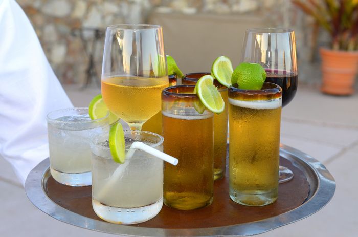 multiple cocktails with beer standing next to each other