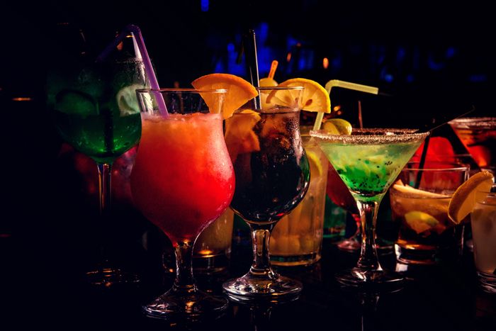 a row of various vodka cocktails