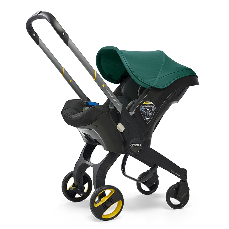 Doona Car Seat & Stroller with a green cover